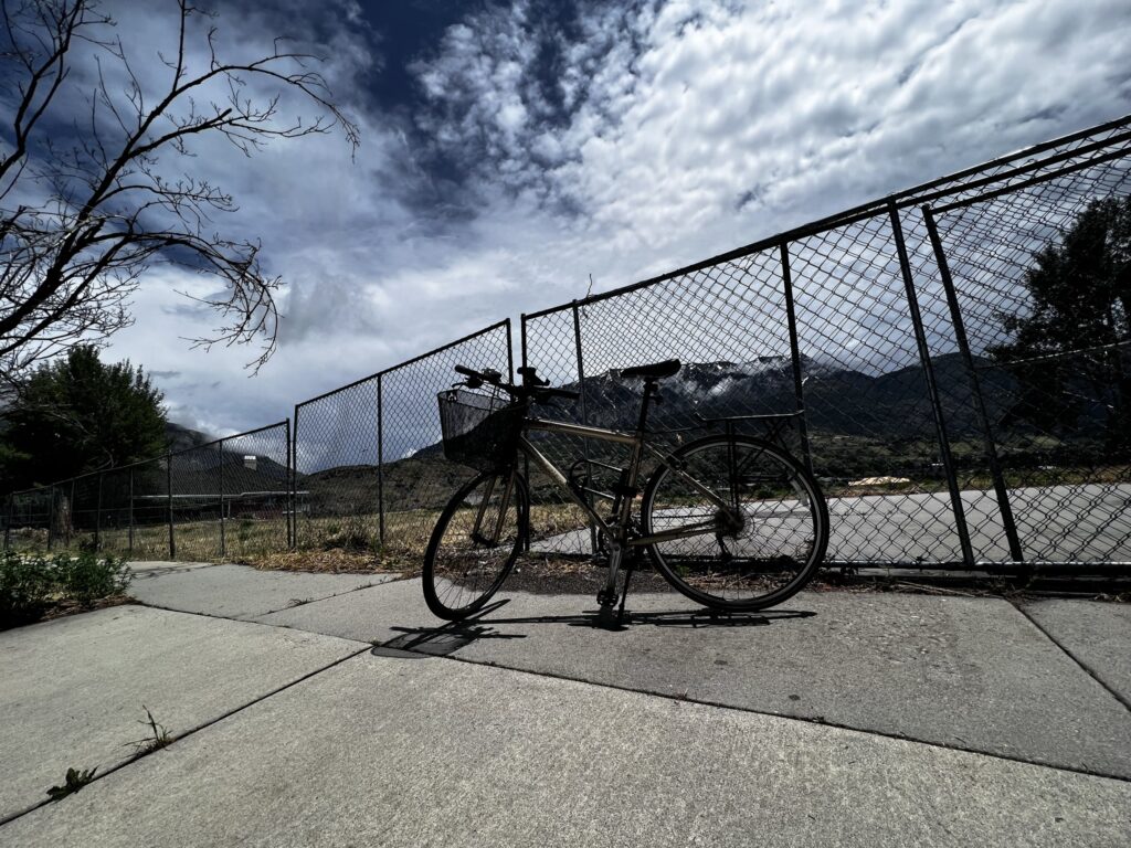 A bike sitting in front of a fence